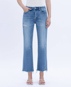 Light blue jeans worn by a person on a white background