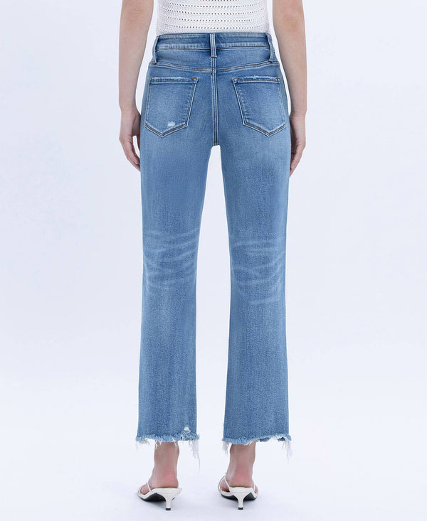 Light blue jeans worn by a person on a white background