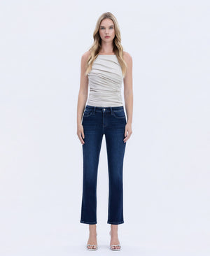 Woman wearing dark wash straight-leg jeans with a flattering mid-rise fit, styled with a neutral ruched sleeveless top, shown in front view.
