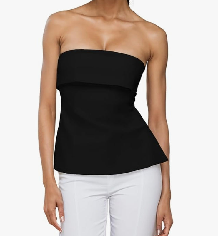 Black strapless top worn by a person on a white background