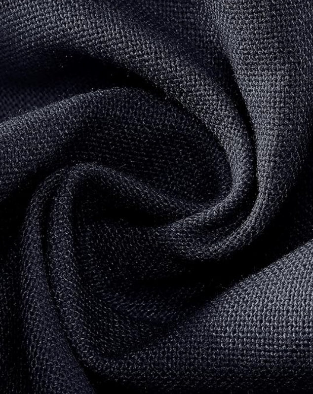 Close-up of dark blue fabric with a textured pattern