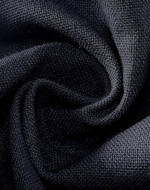 Close-up of dark blue fabric with a textured pattern