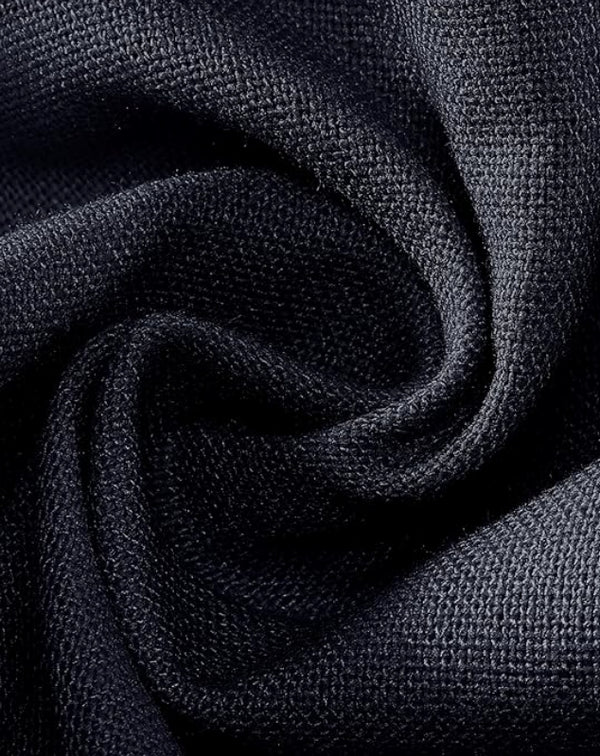 Close-up of dark blue fabric with a textured pattern
